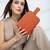   burnt orange polyester travel pouch