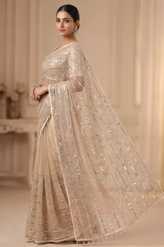 women's rust net partywear saree with unstitched blouse