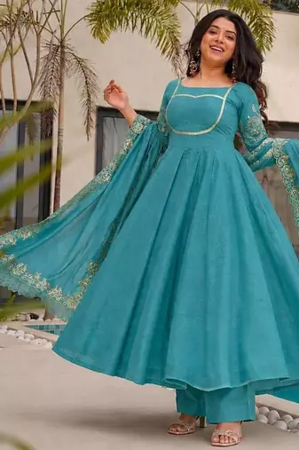 teal green color fancy embroidery sequin and cording work silk blend gown set