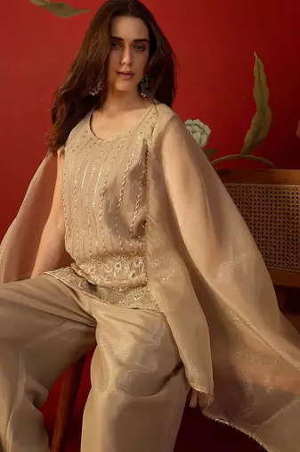Beige silk chiffon embroidered kurta set.