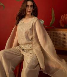 Beige silk chiffon embroidered kurta set.