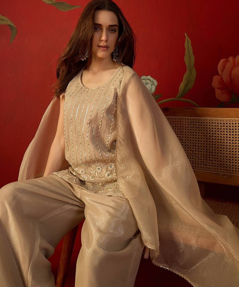 Beige silk chiffon embroidered kurta set.
