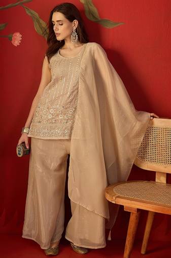 Beige silk chiffon embroidered kurta set.