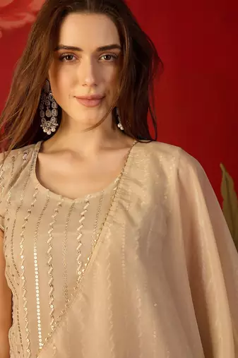 Beige silk chiffon embroidered kurta set.