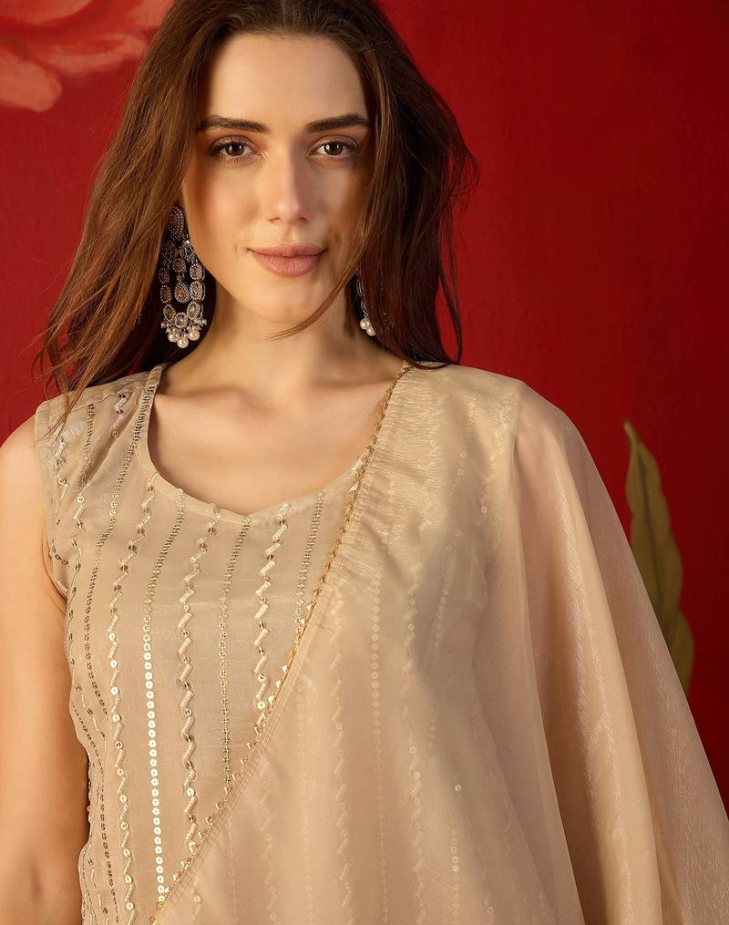 Beige silk chiffon embroidered kurta set.