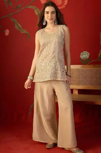 Beige silk chiffon embroidered kurta set.