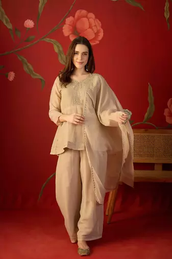 Beige silk chiffon embroidered kurta set.