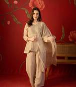 Beige silk chiffon embroidered kurta set.