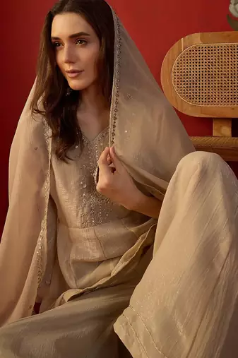 Beige silk chiffon embroidered kurta set.