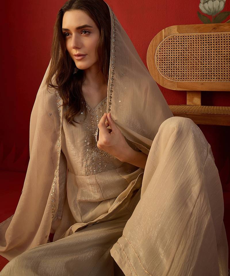 Beige silk chiffon embroidered kurta set.