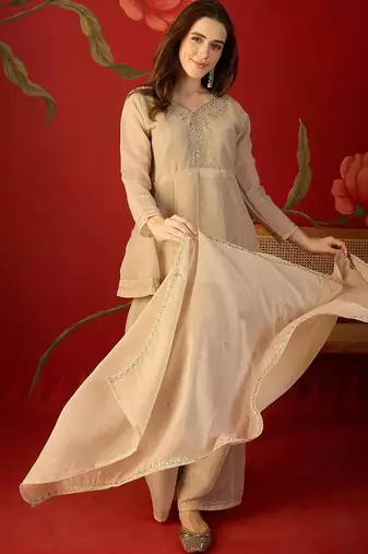 Beige silk chiffon embroidered kurta set.