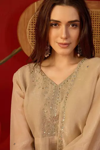 Beige silk chiffon embroidered kurta set.