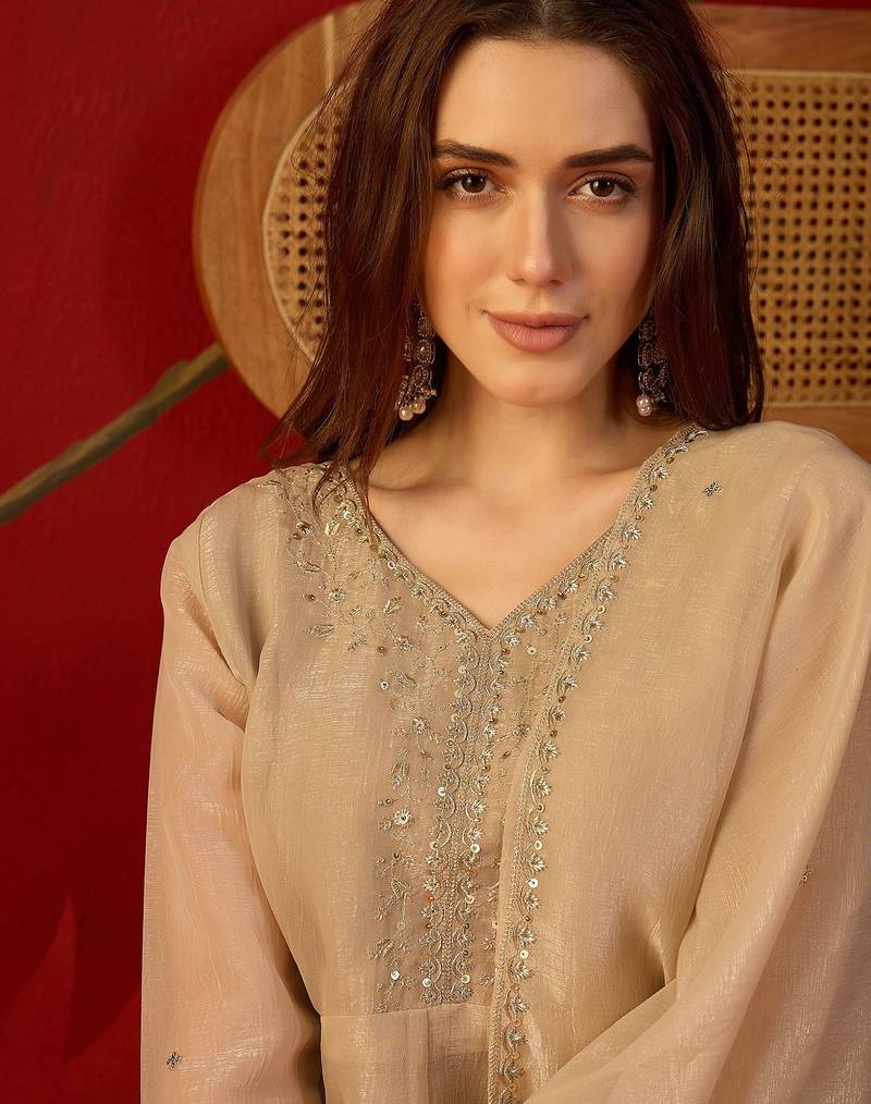 Beige silk chiffon embroidered kurta set.