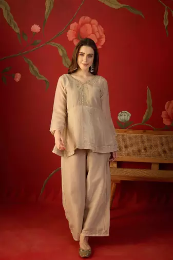 Beige silk chiffon embroidered kurta set.