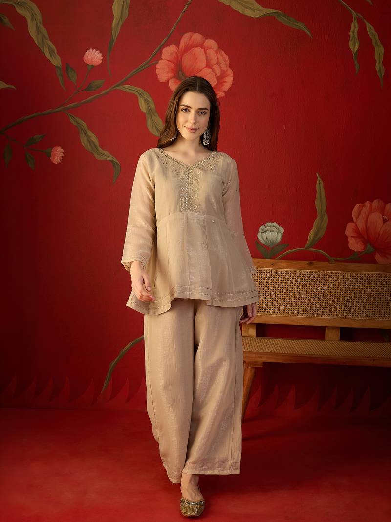Beige silk chiffon embroidered kurta set.