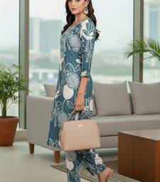 Women Ethnic Motifs Printed Regular Thread Work Kurta with Trousers
