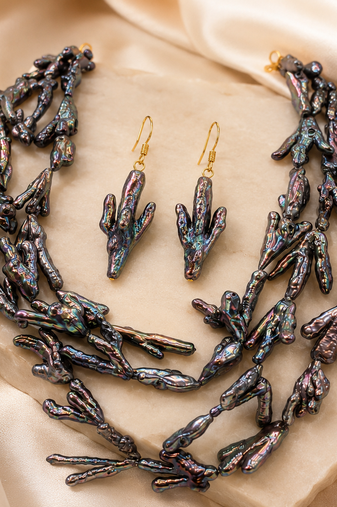 Baroque pearl necklace and earring set, dark iridescent multi-strand necklace, cactus-shaped earrings.