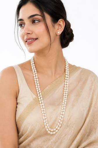 Double strand oval pearl necklace and earrings set, white long mala style, silver-tone clasp, stud earrings included.