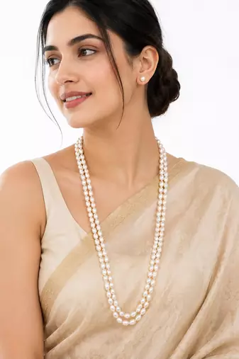 Double strand oval pearl necklace and earrings set, white long mala style, silver-tone clasp, stud earrings included.
