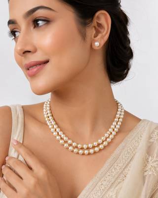 Double strand pearl necklace set with gold rondelle spacers includes stud earrings, layered design. 1