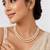 Double strand pearl necklace set with gold rondelle spacers includes stud earrings, layered design.