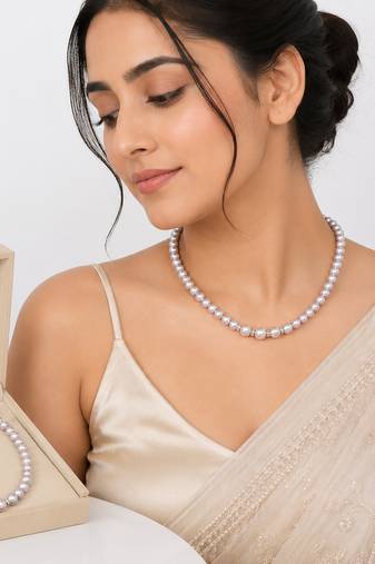 Pearl strand necklace with crystal rondelle spacers, lavender magnetic clasp, graduated pearls.