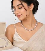 Pearl strand necklace with crystal rondelle spacers, lavender magnetic clasp, graduated pearls.