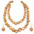 Freshwater coin pearl necklace set with earrings, peach gold double strand, baroque texture, iridescent lustre.