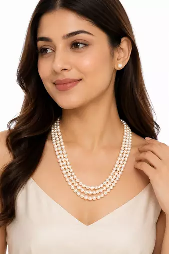 3-layer pearl necklace and earring set, white stud earrings included, gold-tone clasp, layered design.