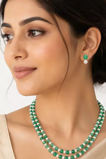 Double strand green beads and pearl necklace set with earrings.
