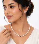 Freshwater pearl necklace and stud earrings set, pink rice-shaped pearls, stud earrings included, graduated design.
