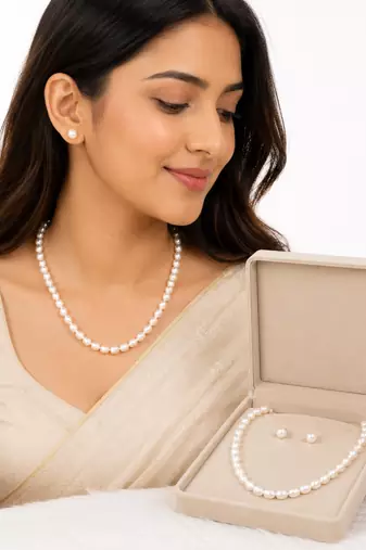 White oval pearl necklace and stud earrings jewellery set rice-shaped pearls, stud earrings included.