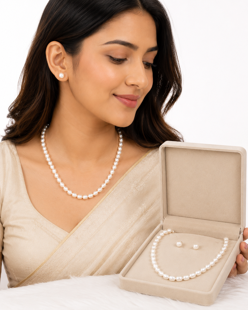 White oval pearl necklace and stud earrings jewellery set rice-shaped pearls, stud earrings included.
