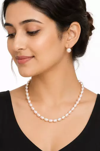 Freshwater pearl necklace and earrings set, white oval beads graduated design, drop earrings included, gold-tone clasp.
