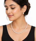 Freshwater pearl necklace and earrings set, white oval beads graduated design, drop earrings included, gold-tone clasp.