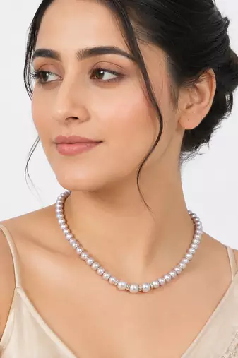 Pearl strand necklace with crystal rondelle spacers, lavender magnetic clasp, graduated pearls.