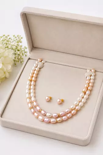 Freshwater pearl double strand necklace and earrings set pink & white pearls, gold-tone spacers. rice pearls.