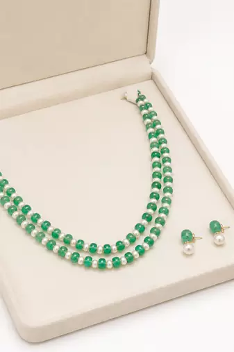 Double strand green beads and pearl necklace set with earrings.
