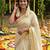 Light chiku linen cotton kerala saree with embroidered blouse