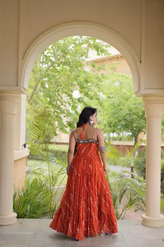 Rust faux georgette leheriya print with kutchi patche work navratri gown
