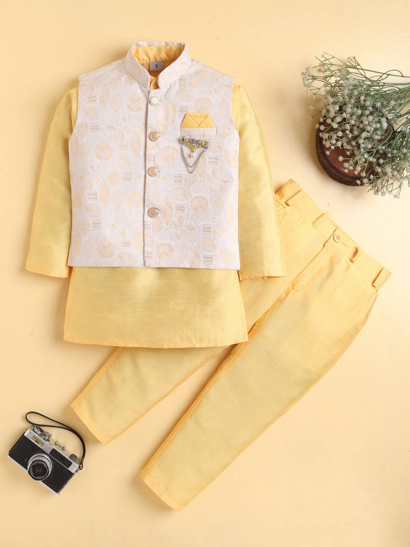 Boys yellow cotton blend kurta pyjama set with jacquard leaf pattern waistcoat