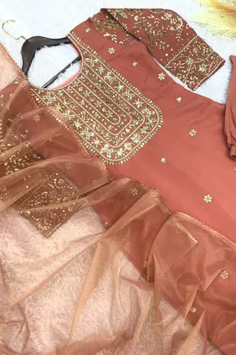peach color fancy beads and embroidery and sequence work and ready maid lace border silk blend kurti set
