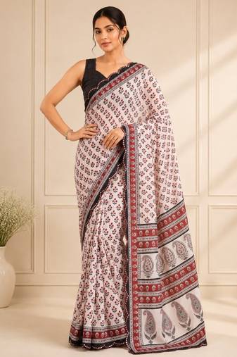 white heavy silk blend mirror work saree