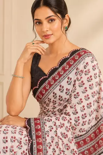 white heavy silk blend mirror work saree