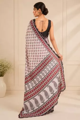 white heavy silk blend mirror work saree