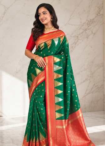 emerald green color zari and weaving design all over with rich pallu kanchi silk blend saree