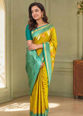 mustard yellow color zari and weaving design all over with rich pallu kanchi silk blend saree