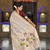 Cream cotton silk saree with colorful floral weaving pallu with blouse