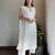 Off-white chikankari kurta set with georgette pants & dupatta, stitched