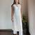 Off-white chikankari kurta set with georgette pants & dupatta, stitched